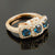 Handmade Ring with Three London Blue Topaz Surround by Diamonds in 14k Rose Gold