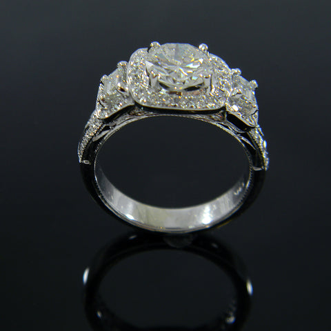 Cushion Shaped Top with Round Center Diamond Flanked by 2 Emerald Cut Diamonds